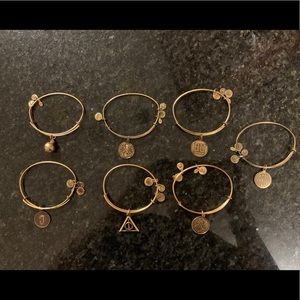 Alex and Ani gold bangle bracelets.